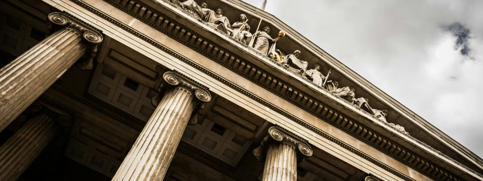 Classical building with marble columns representing institutional standards