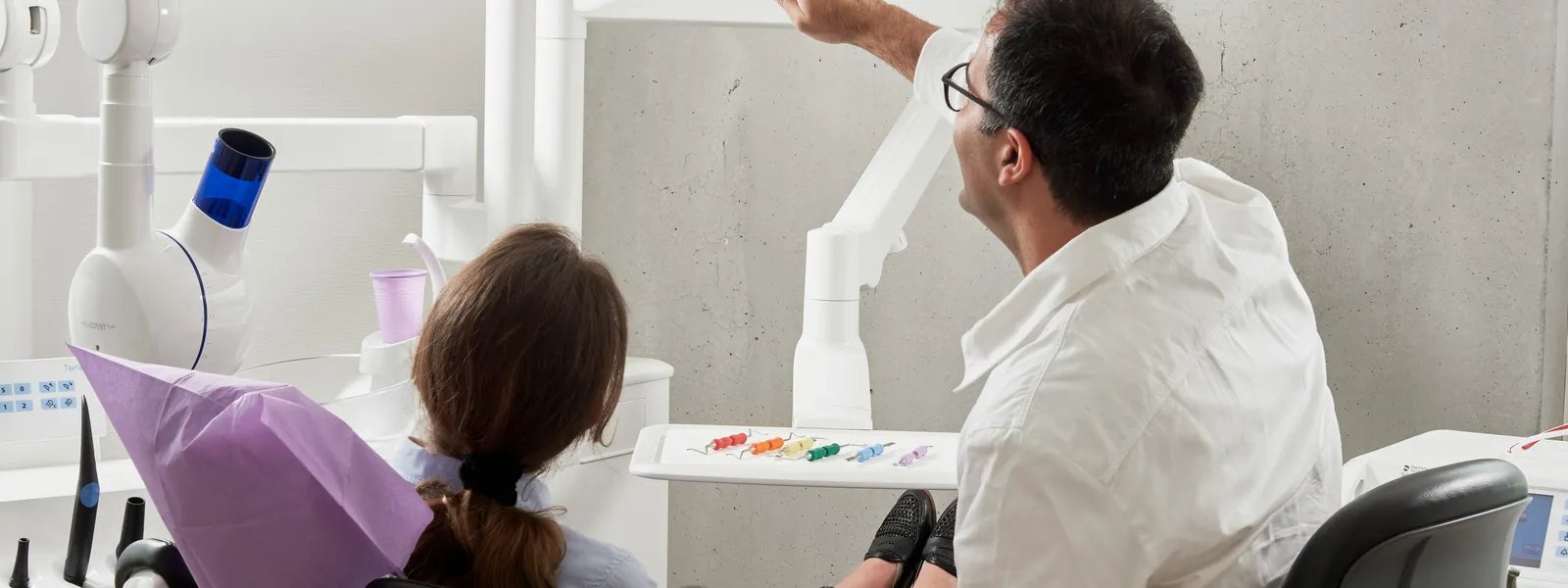 Dentist explaining an x-ray to a patient during a consultation