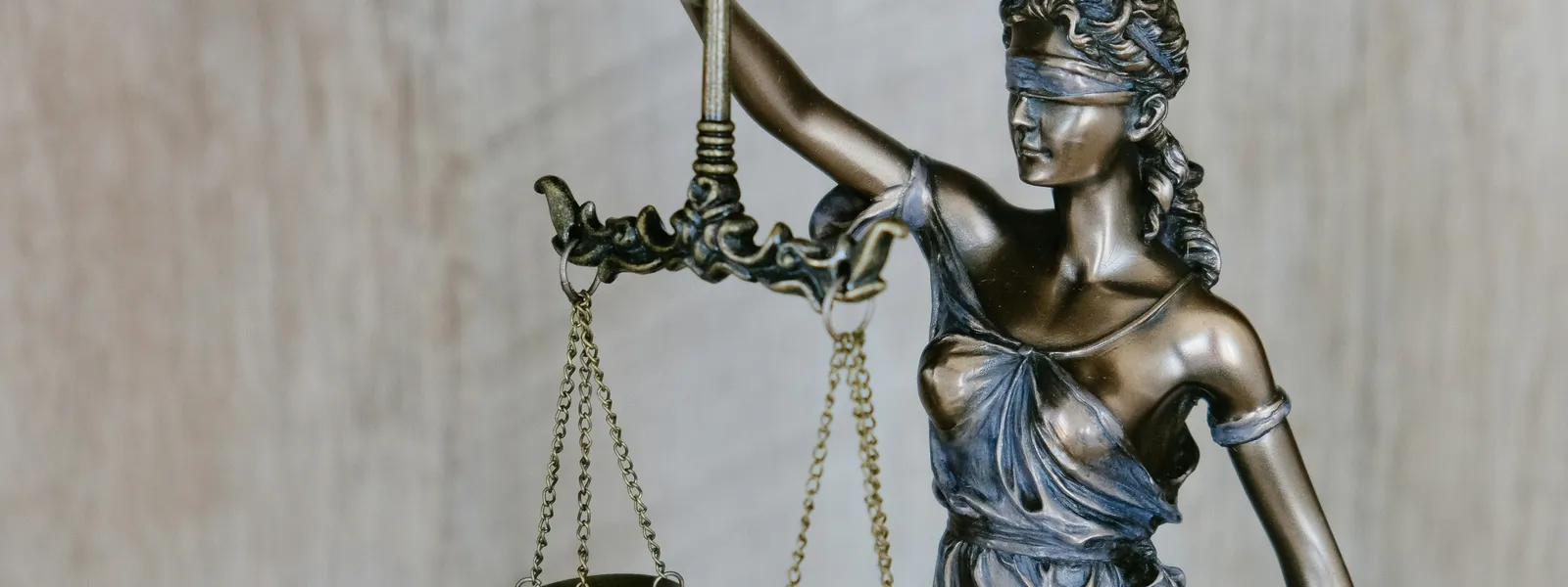 Bronze scales of justice symbolizing legal compliance